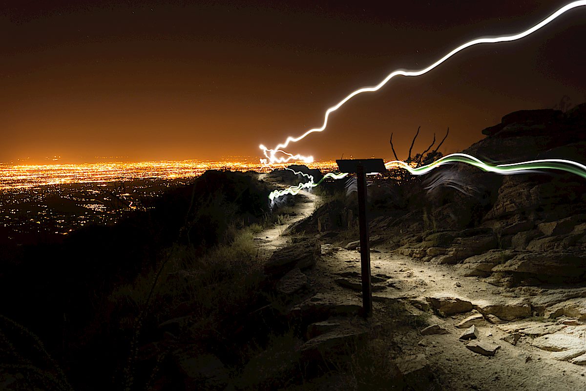 Headlamp trails at the official end of the Blackett's Ridge Trail with Tucson in the background. September 2013