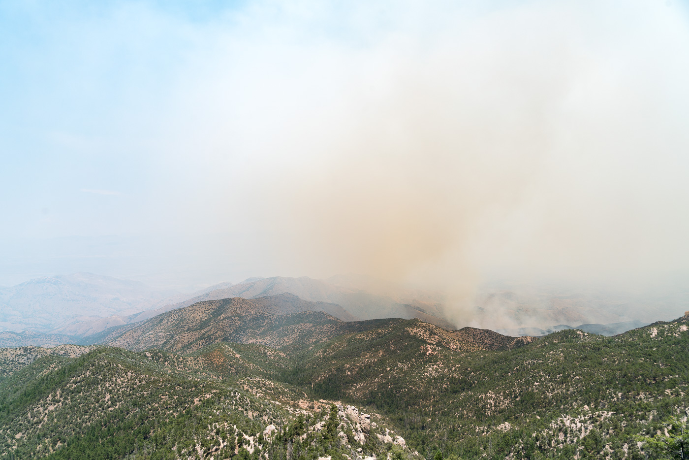 Looking down into a smoke obscured the San Pedro Valley - Edgar Canyon on the left. July 2017.