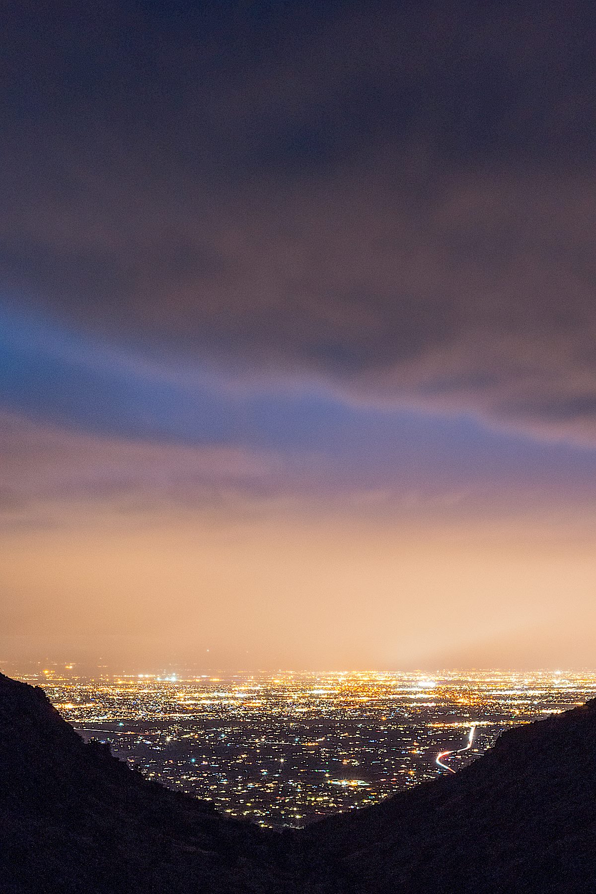 City lights and clouds from a storm from the Babad Do'ag Trail. December 2014