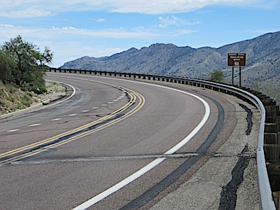 A sign on the highway for the Babad Do'ag Trail points you across the highway to the start of the trail - located just up mountain from the parking area. August 2013