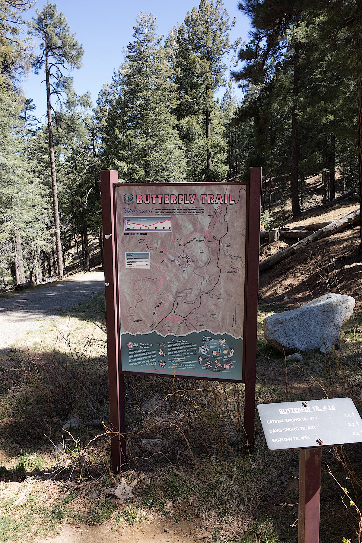 Trail map sign and small trail sign at the Butterfly Trailhead. April 2014.