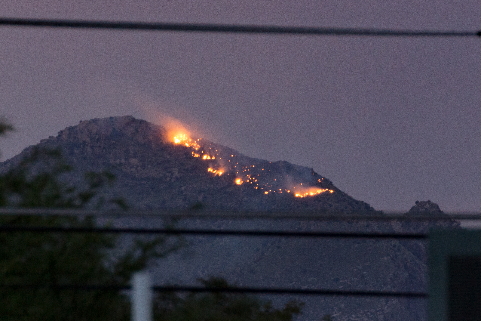 A fire burning just below Pusch Peak in the Push Ridge Wilderness, Santa Catalina Mountains, Coronado National Forest. August 2015.