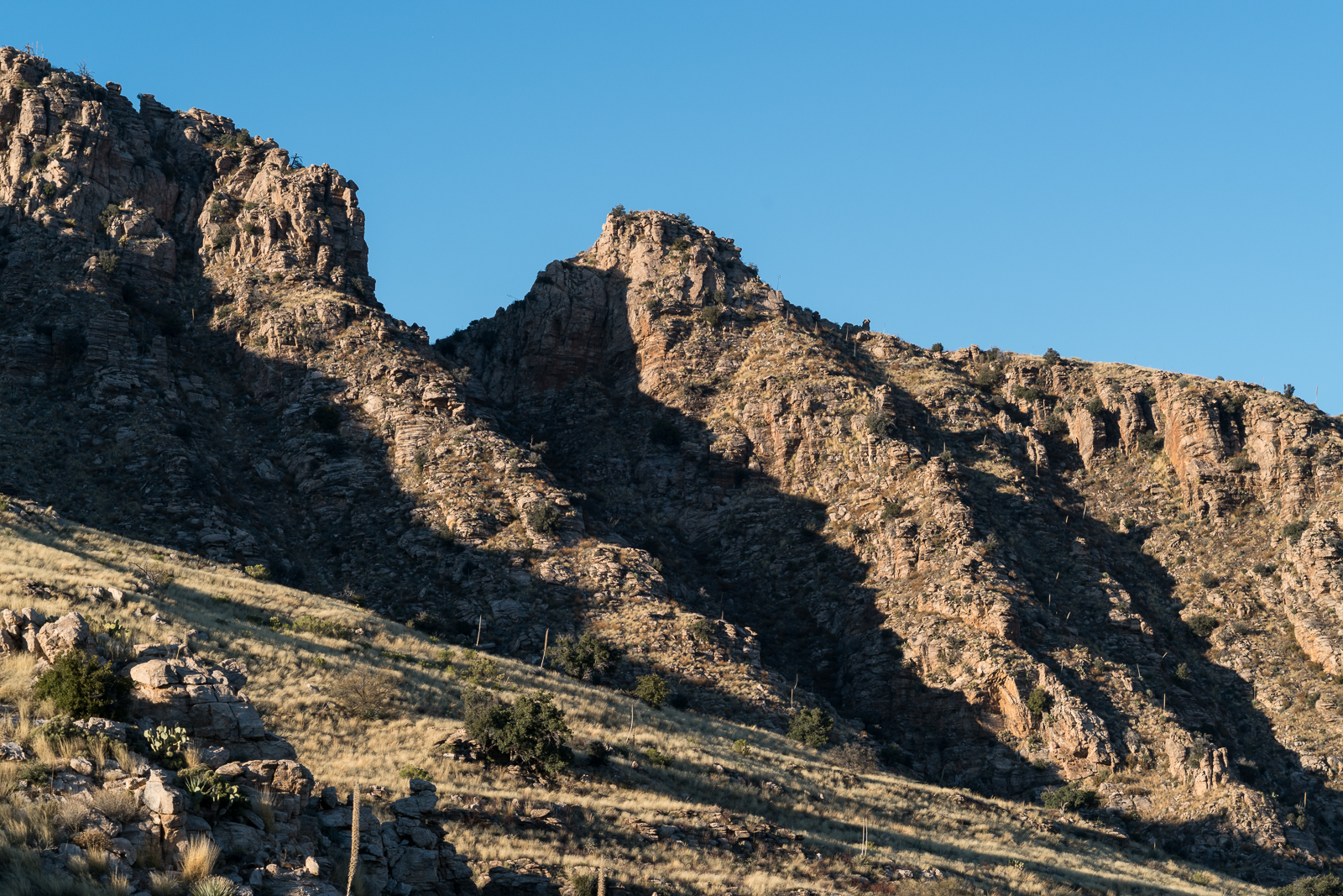 Cliffs and shadows from the Babad Do'ag Trail. January 2016.
