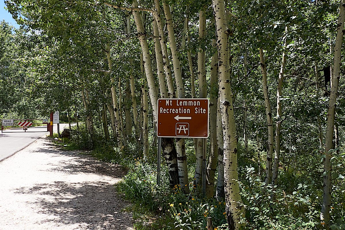 Mount Lemmon Recreation Area Sign - the (closed/locked) gate to the facilities at the top of the mountain are visible on the left. August 2017.
